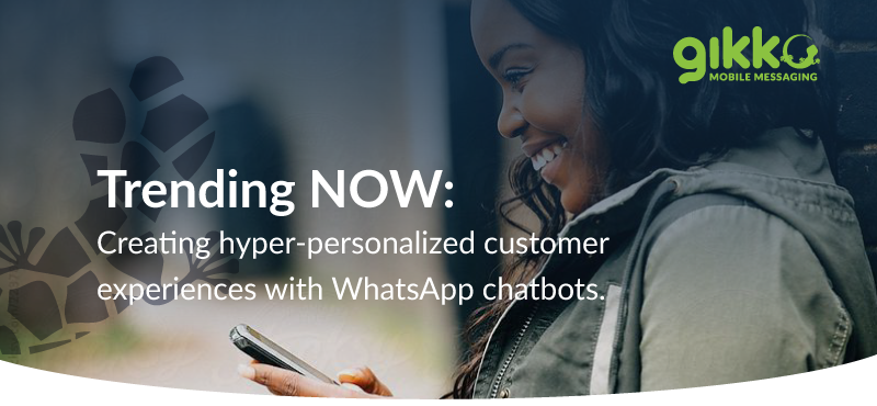 smiling woman holding smartphone with gikko branding and statement about creating hyper personalised customer experiences with whatsapp chatbots